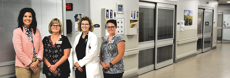 Newman Regional Health team members (L to R) Cathy Pimple, Chief Quality and Compliance Officer; Nina Topper, Clinical Analyst; Dr. Alana Longwell, Hospitalist and Inpatient Rehabilitation Medical Director; and Aubrey Arnold, Care Manager.